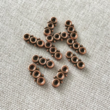 Load image into Gallery viewer, Copper Spacer Bar - 3 Strand - 5mm x 12mm - Copper Plated Pewter - Pack of 10 Spacer Bars - The Attic Exchange