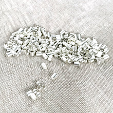 Load image into Gallery viewer, Silver Plated Crimp Tubes and Bead Mix - 2mm - Package of 10 grams of beads - The Attic Exchange