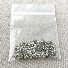 Load image into Gallery viewer, Silver Plated Crimp Bead Mix - Assorted Sizes - Package of 4 grams of beads - The Attic Exchange