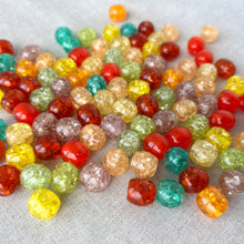 Load image into Gallery viewer, Close-up of colorful crackle acrylic beads in assorted colors scattered on a light surface, showcasing smooth round shapes and textured crackle finish, Bead mix crackle acrylic - assorted colors - 12mm round - Pack of 100.