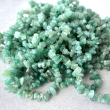 Load image into Gallery viewer, Close-up of light green irregular shaped stones strung together showcasing Green Aventurine - Gemstone - Chip beads with a natural polished finish.