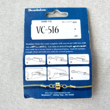 Load image into Gallery viewer, Beadalon Chain Kit - 0.9mm Round Cable - Silver Plated - 2-Meters displayed on blue packaging with assembly instructions and gold-colored chain with clasp attached at the bottom.