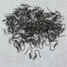Load image into Gallery viewer, A collection of gunmetal fish hook earwires displayed on a light fabric background, showing a large pack of 150 earwires - 75 pairs for jewelry making and earring findings.