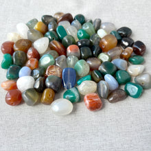 Load image into Gallery viewer, Close-up of a variety of colorful polished stones in different shades of green, blue, brown, white, and orange, labeled Multi-Agate (natural / dyed / heated) - Medium Tumbled Nugget.