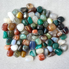 Load image into Gallery viewer, A collection of colorful polished stones in various shades of green, blue, brown, red, white, and gray, labeled as Multi-Agate (natural / dyed / heated) - Medium Tumbled Nugget.