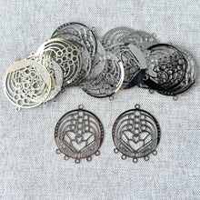 Load image into Gallery viewer, Drop, Lazer Lace™, silver-plated brass, 28x24mm round with fancy heart, 5+1 loops. Sold per pkg of 20, delicate round filigree charms with heart design for jewelry making.