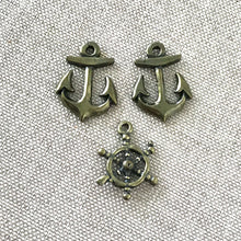 Load image into Gallery viewer, Nautical Charms - Anchor, Wheel - Antique Gold - Package of 3 Charms - The Attic Exchange