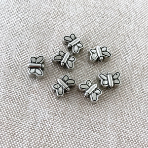 Tibetan Silver Butterfly Beads - Antique Silver - 8mm x 6mm - Vertical Drill - Package of 7 Beads - The Attic Exchange