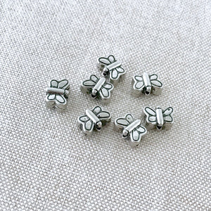 Tibetan Silver Butterfly Beads - Antique Silver - 8mm x 6mm - Vertical Drill - Package of 7 Beads - The Attic Exchange