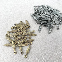 Load image into Gallery viewer, Silver and Gold Plated Feather Charms - Silver Plated, Gold Plated - 22mm - Feathers - Package of 31 Gold and 82 Silver Charms - The Attic Exchange