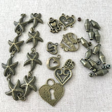 Load image into Gallery viewer, Oxidized Gold Charms - Starfish Hearts Spacers - Mixed Lot - Package of 35 Pieces - The Attic Exchange