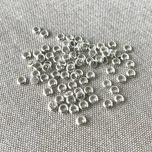 Load image into Gallery viewer, Shiny Silver Plated Circle Spacer Beads - 4mm - Circle - Silver Plated - Package of 80 Beads - The Attic Exchange