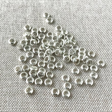 Load image into Gallery viewer, Shiny Silver Plated Circle Spacer Beads - 4mm - Circle - Silver Plated - Package of 80 Beads - The Attic Exchange
